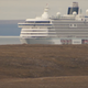 “Its thirteen decks of luxury towered over the bleak, flat Arctic landscape,” reports The National, from which this screencap is pulled.